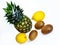 A ripe pineapple with two lemons and three kiwi fruits on white background top view