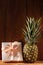 Ripe pineapple on wooden background. Healthy food ingredients, tropical fruits, diet, slimming vegan foods, weight loss