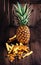 Ripe pineapples on wooden table with ananas stubs