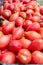 Ripe pink tomatoes /Thai pink egg tomato/ on stand at the marketplace. Selective focus