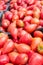 Ripe pink tomatoes /Thai pink egg tomato/ on stand at the marketplace. Selective focus