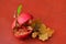 Ripe pomegranate fruit lying on the table with oak leaves