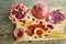 Ripe pomegranate fruit on wooden vintage background