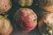 Ripe pomegranate fruits as background. Close up view of pomegranates background. Fresh fruit. Group of vintage pomegranates .