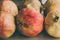 Ripe pomegranate fruits as background. Close up view of pomegranates background. Fresh fruit. Group of vintage pomegranates .