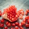 Ripe pomegranate slice and red garnet fruit seeds