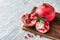 Ripe pomegranates on wooden board