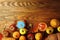 Ripe pumpkins, apples , leaves and persimmons on wooden background.