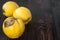 Ripe quinces on vintage wooden table