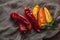 Ripe Ramiro Peppers on linen background, rustic style