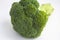 Ripe raw broccoli, inflorescence, on a white background, macro