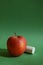 ripe red apple on a green background. back to school. delicious fruit.