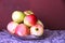 Ripe red apples and yellow apples on the table. still life many red-yellow apples on the table.