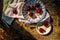 Ripe red cherries in antique blue and white bowl with silver spoon