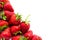 Ripe, red, fresh strawberries with elevated green tails on white background. Summer tasty fruit