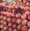 Ripe and red fruit pomegranate and divided into four parts, against the background of pomegranate fruit