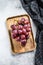 Ripe red grape. Pink bunch of ripe grape. White background. Top view