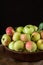 Ripe red and green apples on wooden background. Apples in bowl. Garden fruits. Autumn fruits. Autumn harvest.