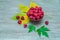 Ripe red raspberries on wooden table