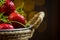 Ripe red strawberries in warm romantic colors with blur background.