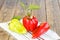 Ripe red and yellow bell peppers on wooden boards. Bulgarian or