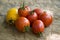 Ripe red and yellow tomatoes on the wood table. Vegetables