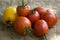 Ripe red and yellow tomatoes on the wood table. Vegetables