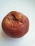 ripe rotten apple on white background, natural organic fruit