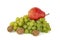 Ripe scarlet fragrant appetizing pear with a sprig of dry walnuts and grapes Kish Mish on a white background