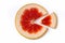 Ripe slice of red grapefruit on a white background close-up. Citrus isolated object. Cut a slice of sour fruit