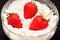 Ripe strawberrie in cream