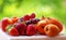 Ripe strawberries, apricot and medlars