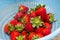 Ripe strawberries being washed with water