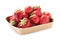 Ripe strawberries in cardboard container isolated