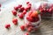 Ripe strawberries and cherries , glass jars. Wood background, rustic style.