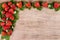 Ripe strawberries on rustic wooden background