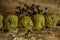 Ripe Sugar-apple Seeds by Unbroken Fruits on Wooden Table