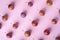 Ripe sweet plum fruits pattern texture, top view, flat lay, pink background