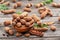 Ripe tamarind fruit, leaves and some tamarind seeds on wooden table