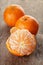 Ripe tangerines closeup photo on wooden table