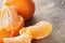 Ripe tangerines closeup photo on wooden table