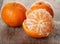 Ripe tangerines closeup photo on wooden table