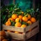 Ripe tangerines and oranges in a wooden box