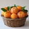 ripe tangerines in a wicker basket