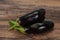 Ripe tasty Eggplant over wooden background