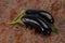 Ripe tasty Eggplant over wooden background