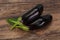 Ripe tasty Eggplant over wooden background