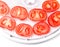 Ripe tomato on food dehydrator tray, ready to dry