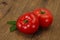 Ripe tomato over wooden background