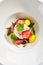 Ripe Tomato Salad with Strawberries, Crab Meat and Strachatella Cheese